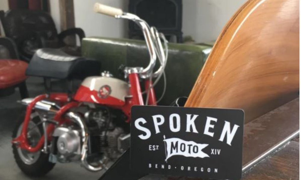 Gift card and bike at Spoken Moto